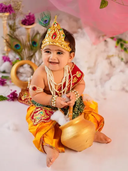 Our little 'Makhan Chor' caught in the act with a pot of butter. We love creating playful scenarios that bring out the charm and mischief of the Krishna theme.