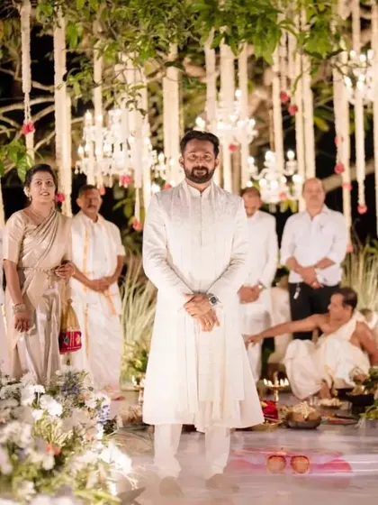 The groom waiting patiently and happily for his bride to arrive at the mandap.