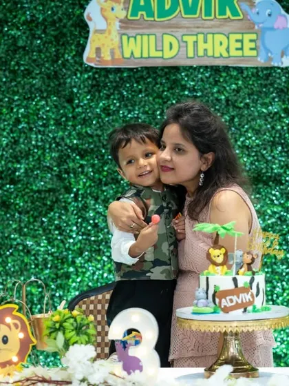 A sweet, candid moment of a mother getting a hug from her son at his third birthday party. These fleeting moments of affection are what make event photography so meaningful.