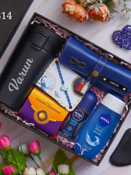 This Rakhi hamper is a self-care package for your brother, containing a personalized temperature bottle, eyewear case, grooming products, and a rakhi.