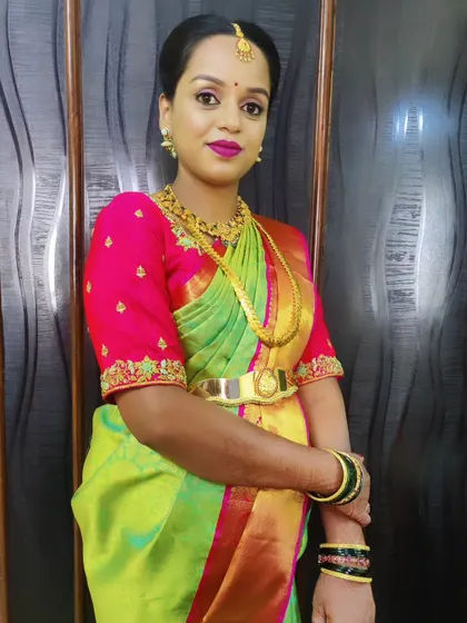 Getting my client Jamuna ready for her baby shower. The makeup is fresh and vibrant, with a fuchsia lip that pops against her lime green and pink saree.