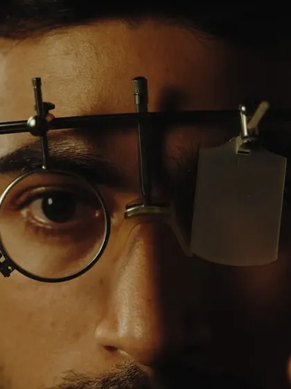 A close-up still from our ad, focusing on the specialized eyewear and intense gaze of the shooter. It's all in the details.