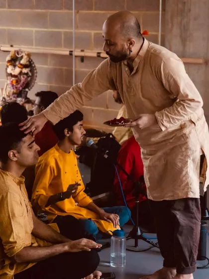 My teacher Mavin Khoo offering blessings to the musicians during a pooja. This image beautifully captures the respect and interdependence between all artists in a performance ensemble.