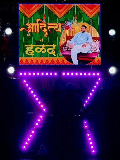 Even for smaller parties, I deliver a big impact. This is my compact DJ setup, customized for a Haldi ceremony with personalized graphics on the LED screen, proving you don't need a huge space to have a professional-looking event.