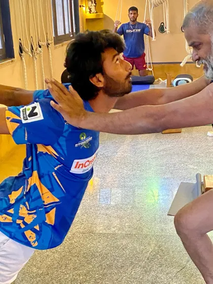 Another view of a partner-assisted chest opener. This kind of work is crucial for overhead athletes like tennis players to maintain shoulder health and a full range of motion.