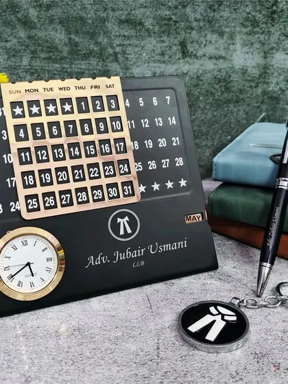 This is a custom desk set I made for an Advocate. The infinite calendar, pen, and keychain are all personalized with the lawyer's name and the advocate symbol, creating a thoughtful and practical gift for legal professionals.