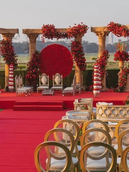 For the love of tradition, a 'Jashn e Ishq' theme brought to life. This design uses bold reds, majestic pillars, and a striking floral moon gate to create a regal and passionate setting for your wedding ceremony.