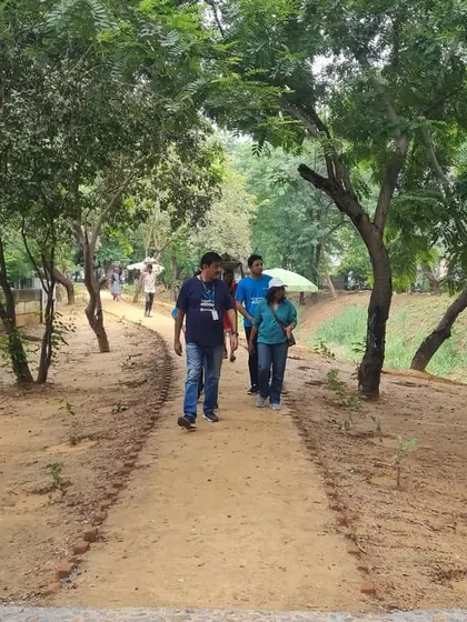 Volunteers walk along the restored path at the Sector 56 creek, a green corridor brought back to life with support from partners like NTT DATA.