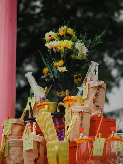 The little details matter. We use creative and personalized elements like these syringe shots and custom mugs to make your Haldi bar unique and memorable.