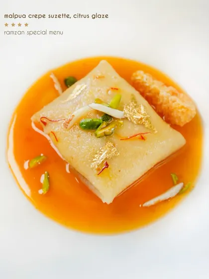 Our malpua crepe suzette with a citrus glaze, from our special Ramzan menu. It’s a beautiful fusion of a classic Indian sweet and a classic French dessert.