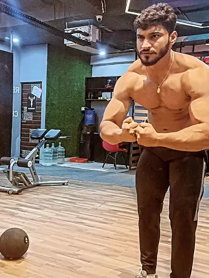 A powerful most muscular pose in the gym.