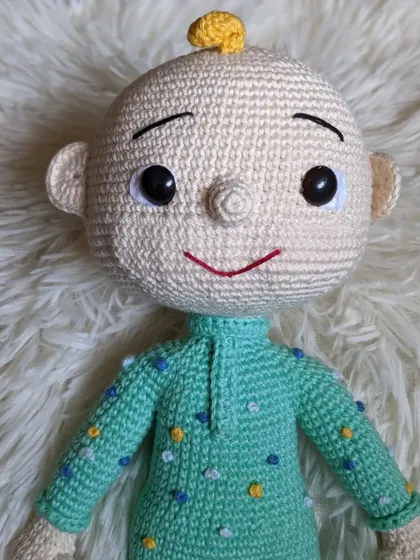 A close-up of the face of the second JJ doll design.