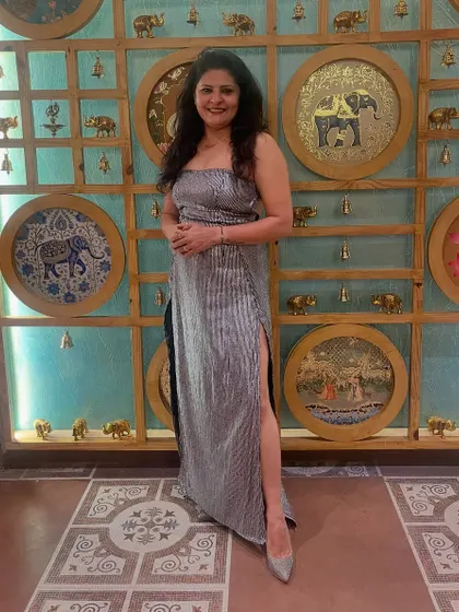 For a launch party, I designed and wore this silver-grey striped co-ord set with an off-shoulder top and a matching high-slit skirt. It's modern, chic, and comfortable.