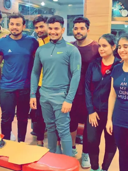 A group photo with the birthday boy and his cake. These moments are just as important as the personal records you set in the gym.