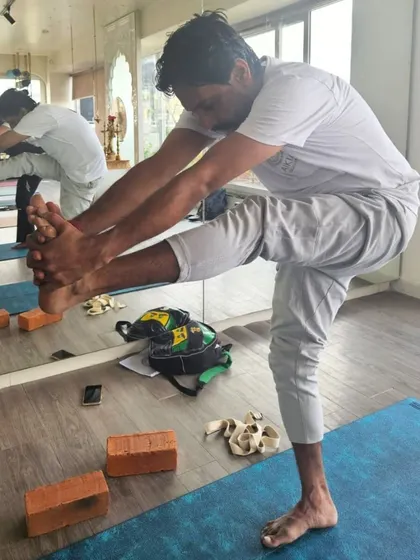 Utthita Hasta Padangusthasana (Extended Hand-to-Big-Toe Pose) requires balance, flexibility, and focus. Our TTC students work on this pose to build stability and hamstring flexibility.