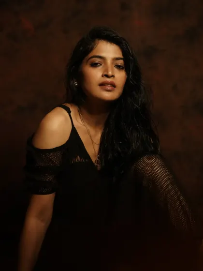 A seated portrait with a focus on mood and atmosphere. This shot shows how I can create a compelling narrative even in a simple studio setup.