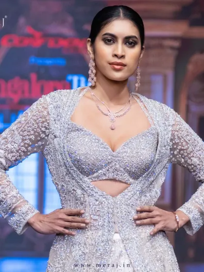 Elegance in every stitch, bling in every detail. This light peach Indo-Western masterpiece is perfectly crafted for your big day.