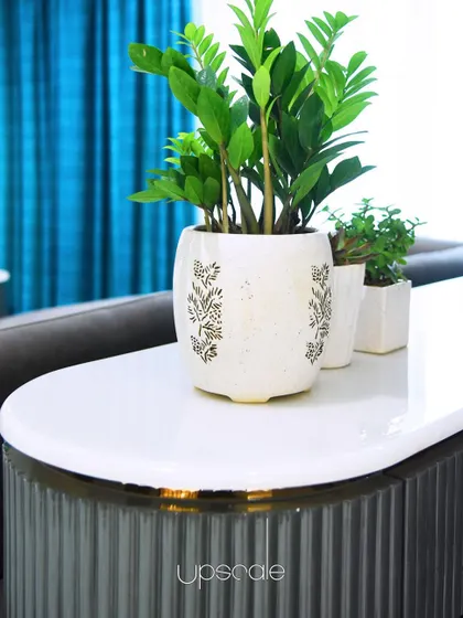 Details make the design. This fluted console table with a marble top and a subtle gold-finished edge adds texture and sophistication to the living space.
