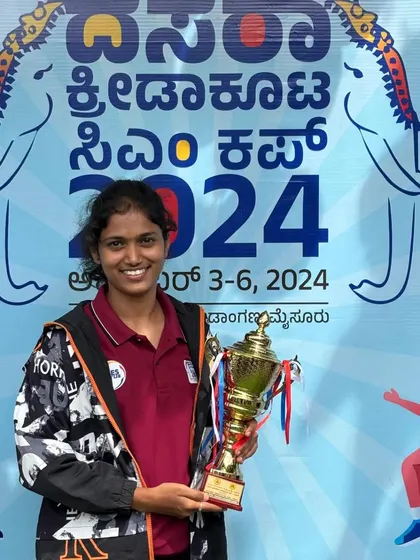 The champion with her trophy. Ramya celebrating her victory at the Dasara Kreedakoota CM Cup 2024.