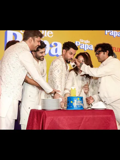 The cast celebrating with a cake-cutting ceremony at the 'Single Papa' launch. We coordinate these special moments within the show flow.