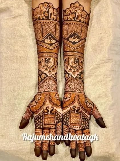 A beautiful design with swans and elephants on the arms, and intricate patterns on the palms.