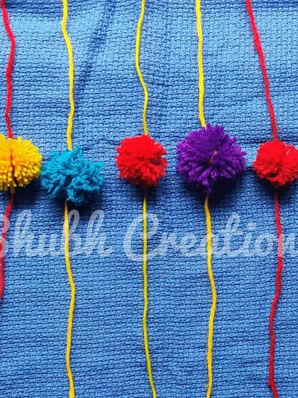 A set of simple yet colorful rakhis made from fluffy yarn pompoms, perfect for a soft and reusable option.