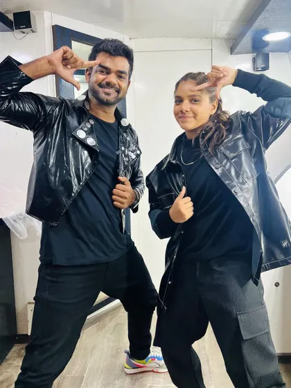 Posing with Ditya after our performance. Our matching outfits and energy show the level of detail and coordination I bring to every choreographed piece.