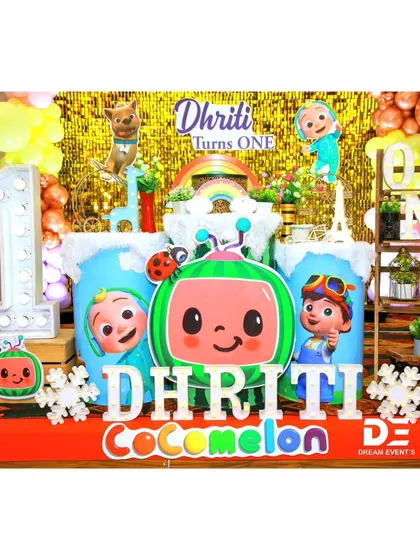 A closer look at the main stage for Dhriti's Cocomelon party, with light-up letters and themed pedestals.
