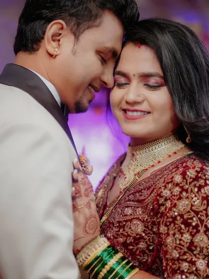 A tender moment between the couple during their reception, lost in each other's embrace.