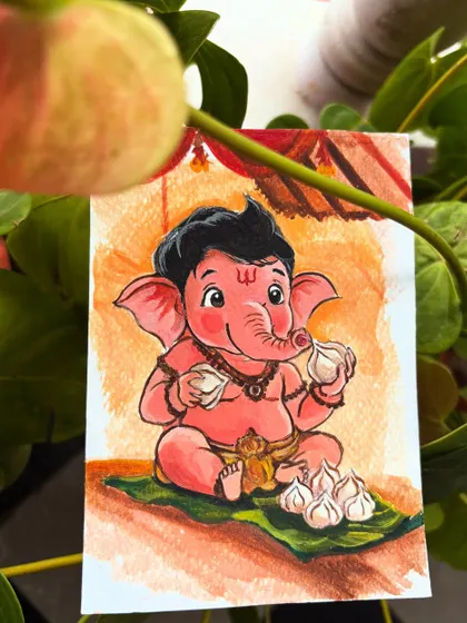 The baby Ganesha painting photographed in a natural setting, highlighting its charming and sweet character.