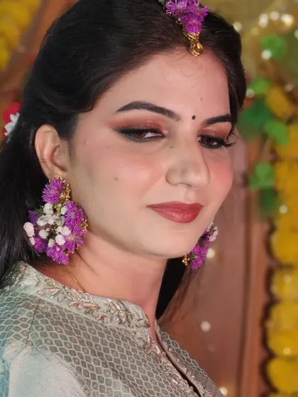 A closer look at the soft brown smokey eye and the custom floral earrings.