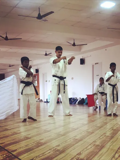 Even inside, the training is intense. I lead a class of black belt students, refining their kata. Mastery is a journey without an end.