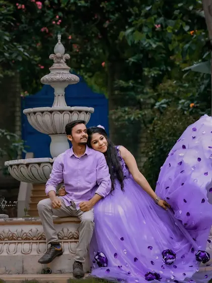 A beautiful couple's maternity shoot featuring my lavender gown with 3D floral details. The flowing fabric is perfect for creating movement and drama in photos.