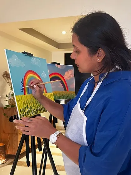 Our instructor guiding a young painter during a kids-only workshop. We're there every step of the way to help their vision come to life.