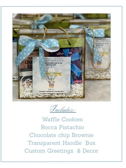This image shows the contents of our transparent handle box return favor. It includes waffle cookies, pistachio roca, and a chocolate chip brownie, with custom decor to match the birthday theme.