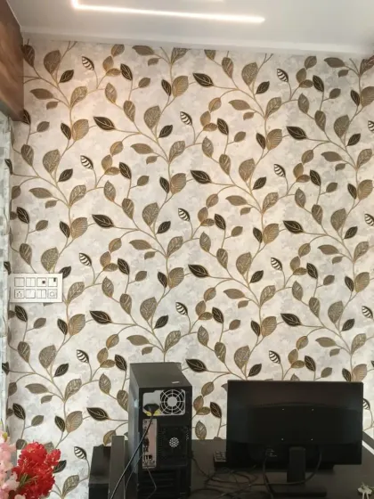 A leaf-patterned wallpaper in earthy tones, perfect for an office reception or study area.