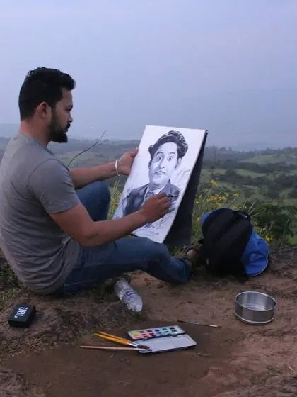 Here I am painting the portrait of Kishore Kumar outdoors. Taking my work into nature, even for a portrait, adds a different energy to the process.