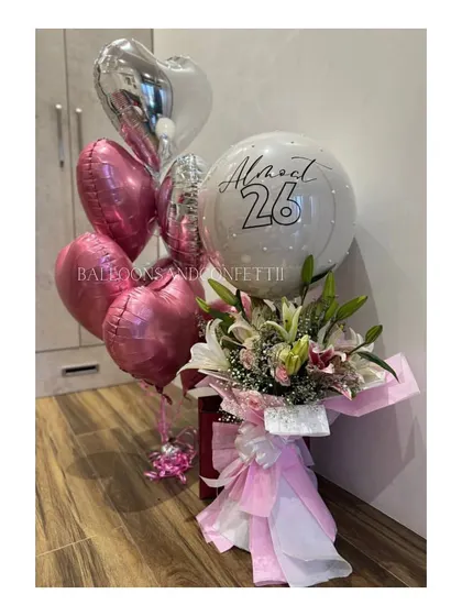 Celebrating "Almost 26" with a beautiful combination of fresh lilies, pink heart balloons, and a custom-printed bubble balloon. This is my popular floral balloon bouquet.