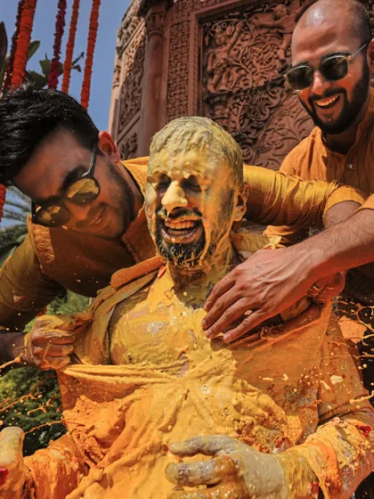 It’s not a Haldi until the groom gets completely covered! We love capturing these playful, high-energy moments that families will cherish forever.