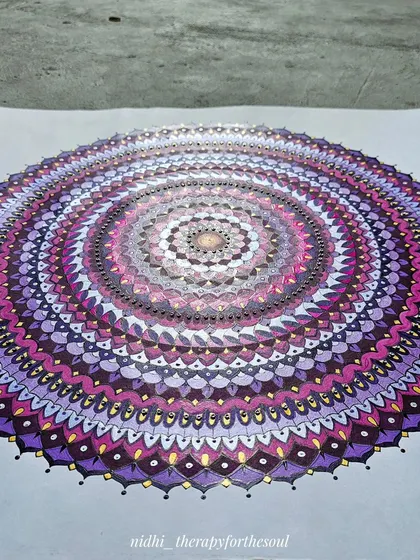 Another perspective of the large magenta mandala, showcasing the depth created by the concentric circles of intricate patterns.