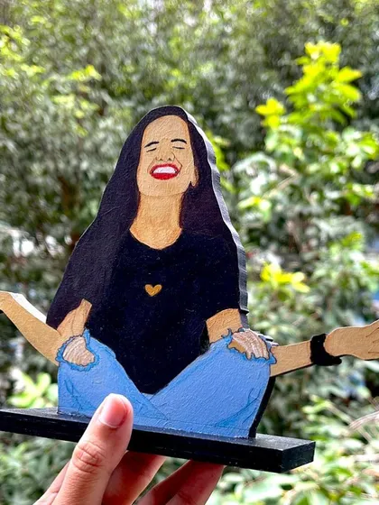 This wooden miniature captures such a joyful, carefree moment. It's a great example of how I can turn a fun photo into a unique piece of art that you can display anywhere.
