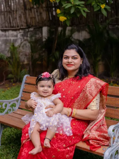 Happiness is holding my world in my arms. A sweet moment between a mother and daughter in the garden.