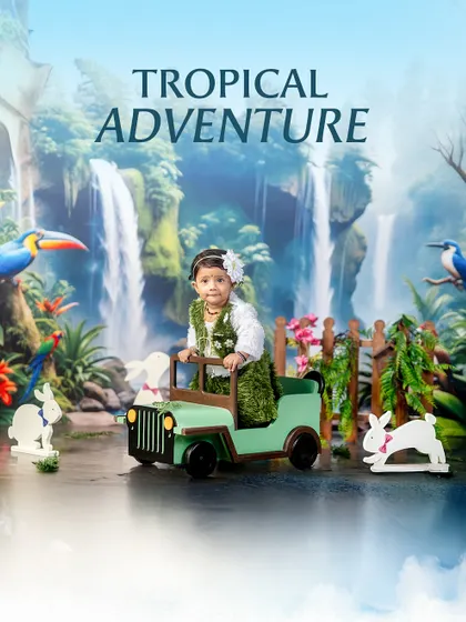 The cutest explorer on the wildest ride. This tropical adventure theme features a little girl in a leafy outfit, ready to drive her jeep through the jungle.