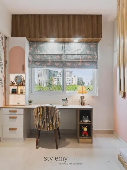 This whimsical kids' room features a bunk bed design that incorporates a wardrobe, sleeping area, and a reading nook, leaving the middle of the room open for play.