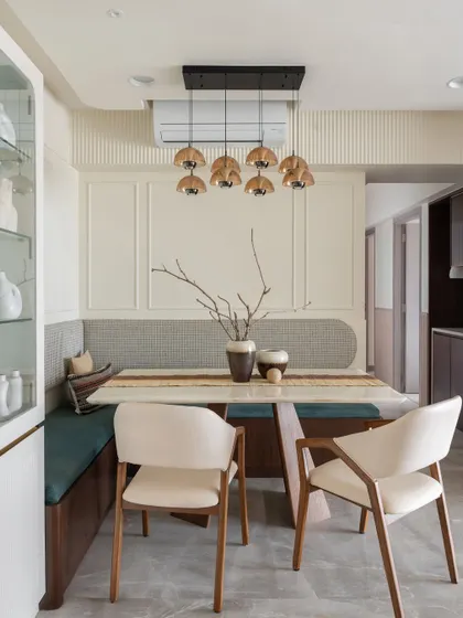 This cozy L-shaped dining bench in the 'Sukoon' home is more than just a place to eat. It’s a space for conversations and connection, designed to bring the family together.