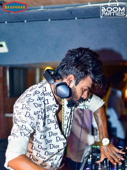 A shot from my set in Bangalore. With headphones on, I'm locked into the details of the sound, ensuring every transition is seamless and every beat hits hard.