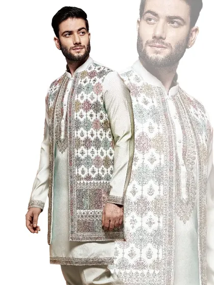 This off-white sherwani features a unique, multi-colored geometric embroidery on the jacket. It is a contemporary piece for the man who appreciates artistry and modern design.