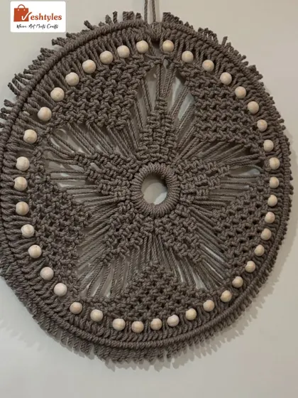 This grey macrame mandala wall hanging with wooden beads adds a beautiful boho vibe to any room. The intricate star pattern is one of my favorite designs.