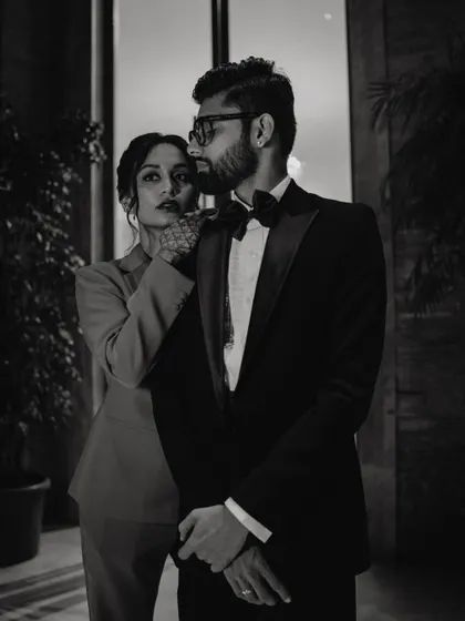 Serving bold looks for the after-party. This black and white shot captures the high-fashion vibe of the couple's stylish celebration.