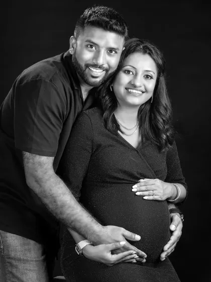 A timeless black and white portrait. The soft lighting and genuine smiles make this a classic and elegant photo that captures the couple's happiness.